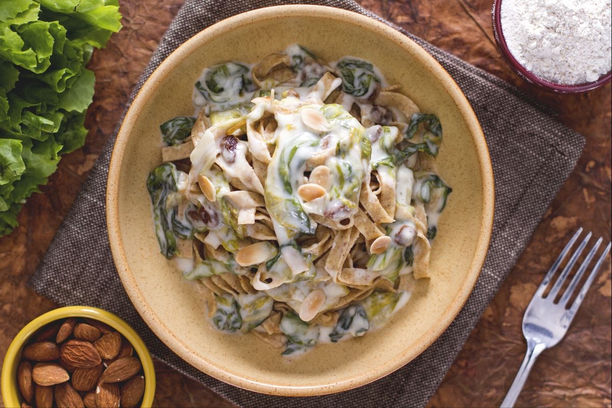 Whole wheat tagliatelle with escarole and taleggio fondue