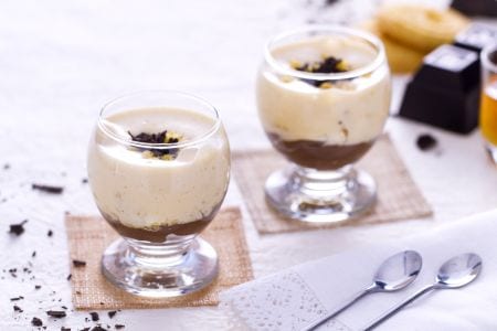Glass with cornmeal cookies, chocolate cream and passito zabaglione