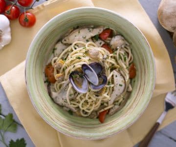 Tonnarelli with clams, porcini mushrooms, and cherry tomatoes