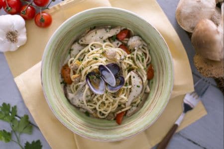 Tonnarelli with clams, porcini mushrooms, and cherry tomatoes