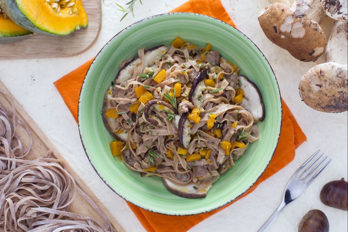 Chestnut flour spaghetti alla chitarra with mushrooms, pumpkin, and sausage