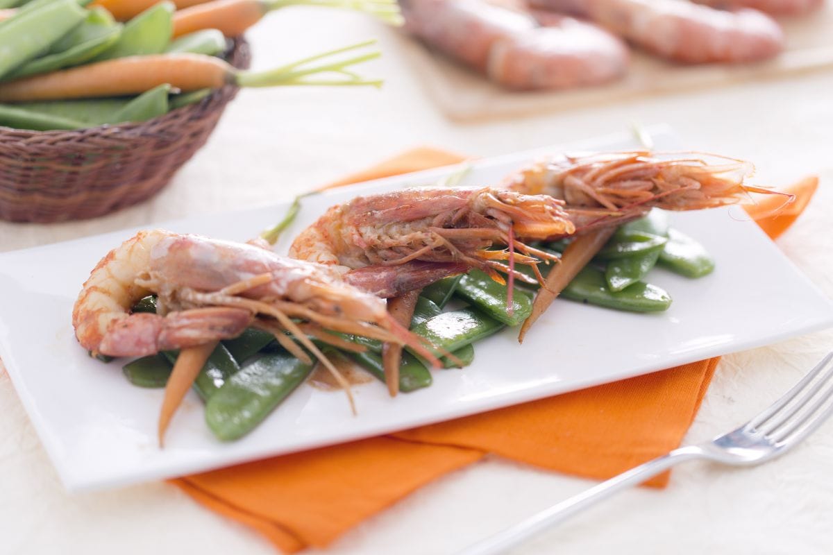Shrimp sautéed in teriyaki sauce with snow peas and baby carrots