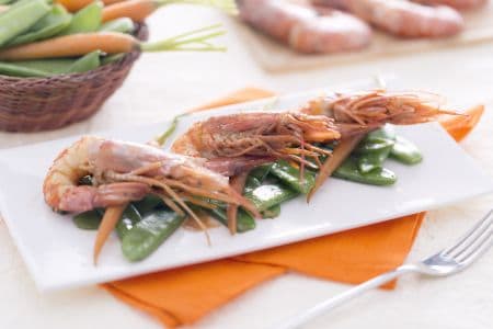 Shrimp sautéed in teriyaki sauce with snow peas and baby carrots