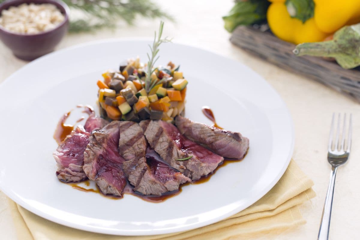 Sliced beef with teriyaki sauce reduction and caponata