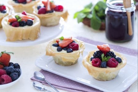 Phyllo pastry baskets with white chocolate cream and berry jam