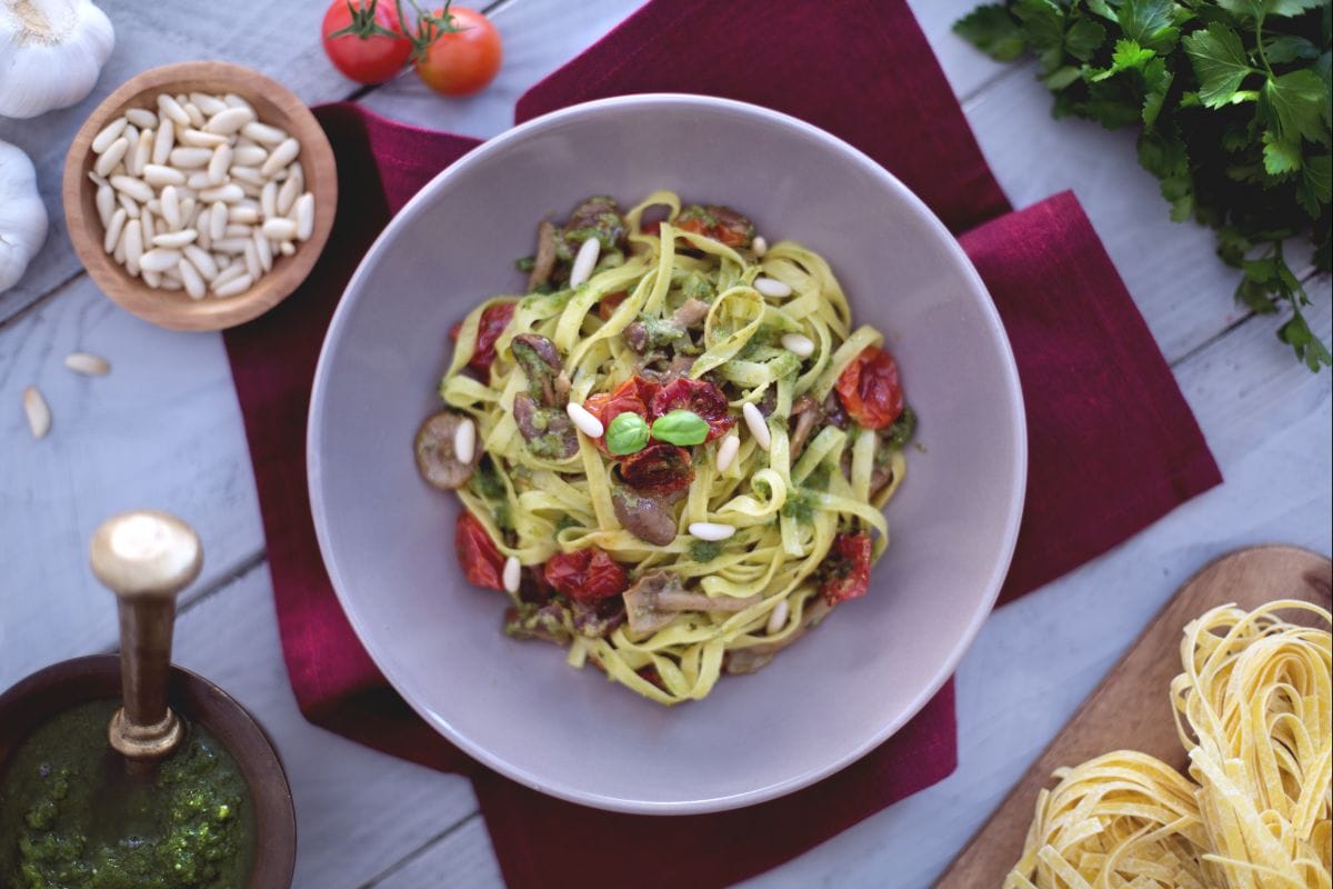 Tagliatelle with confit cherry tomatoes, honey mushrooms and pesto