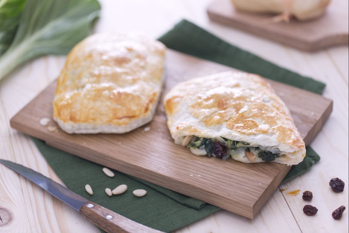 Puff pastry filled with chard, pine nuts, and raisins