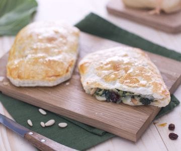 Puff pastry filled with chard, pine nuts, and raisins