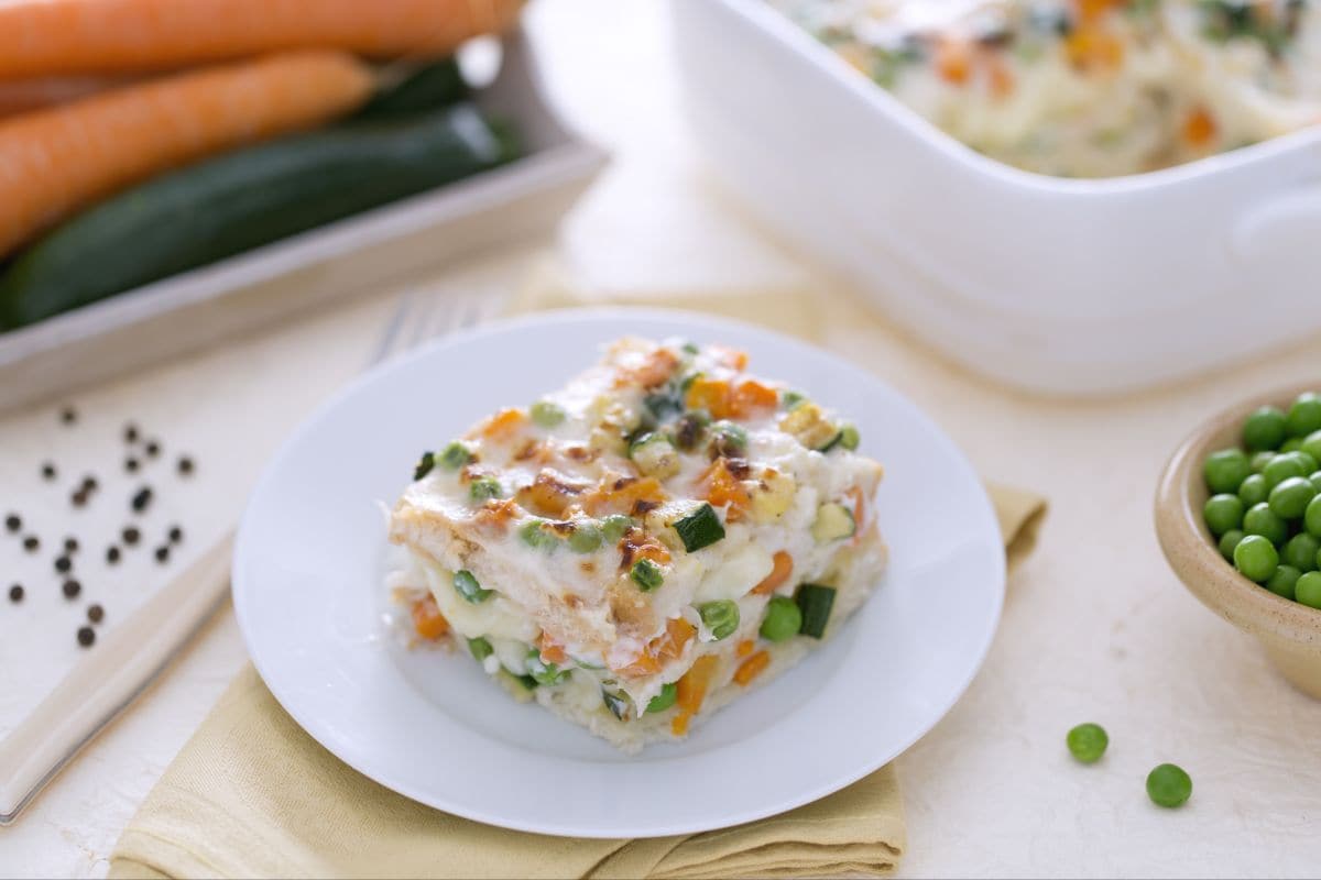 Lasagna with sliced bread, cheese, and vegetable ragù