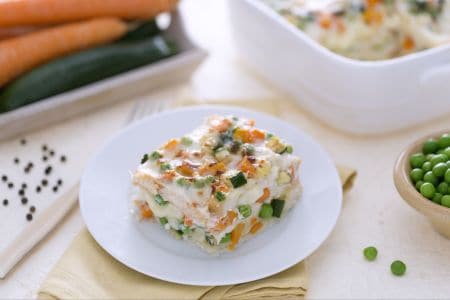 Lasagna with sliced bread, cheese, and vegetable ragù