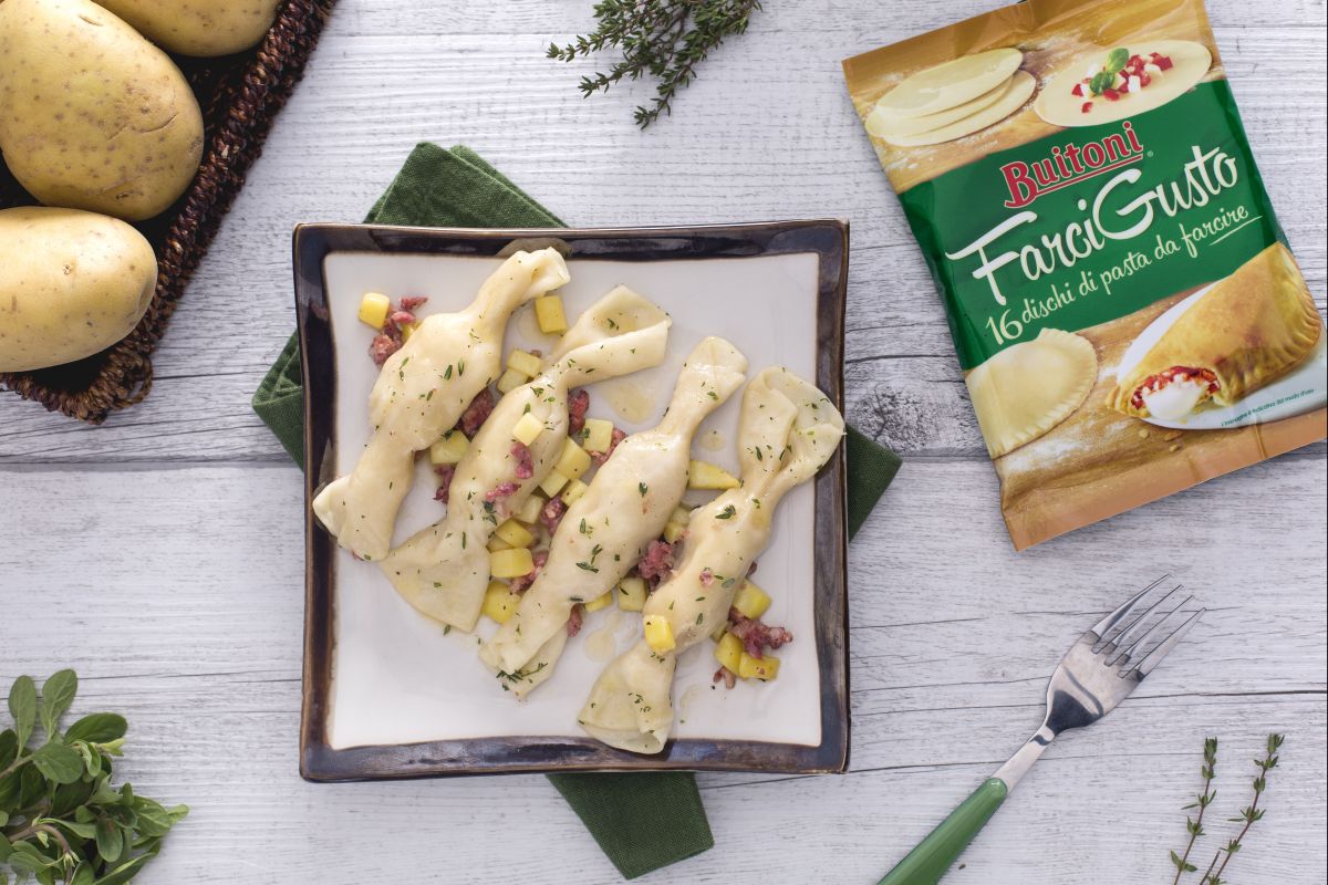 Candy filled with potatoes and sausage with aromatic herbs