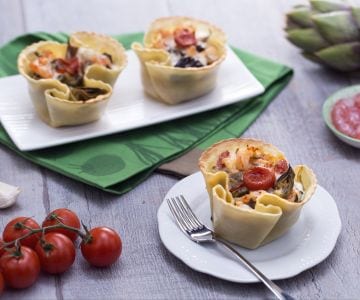 Fresh pasta basket with artichokes, shrimp, and confit cherry tomatoes