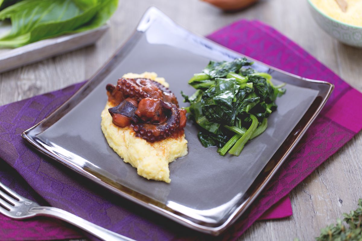 Polenta with stewed octopus and sautéed herbs
