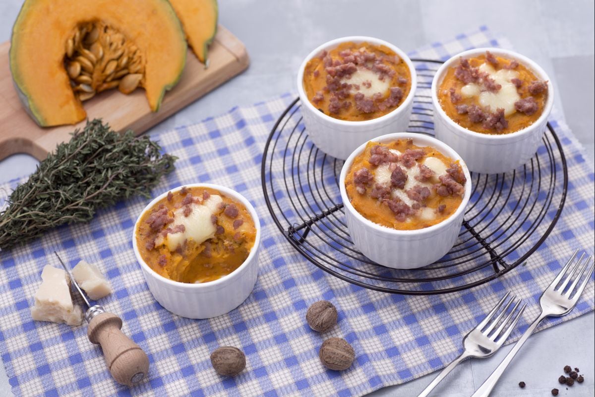 Single-serving gratin of potatoes, pumpkin, and sausage