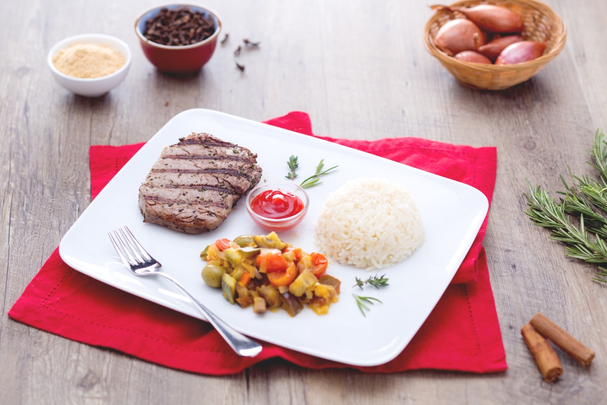 Spicy grilled beef with pilaf rice and spring vegetables