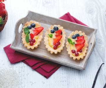 Rice boats with fresh red fruits