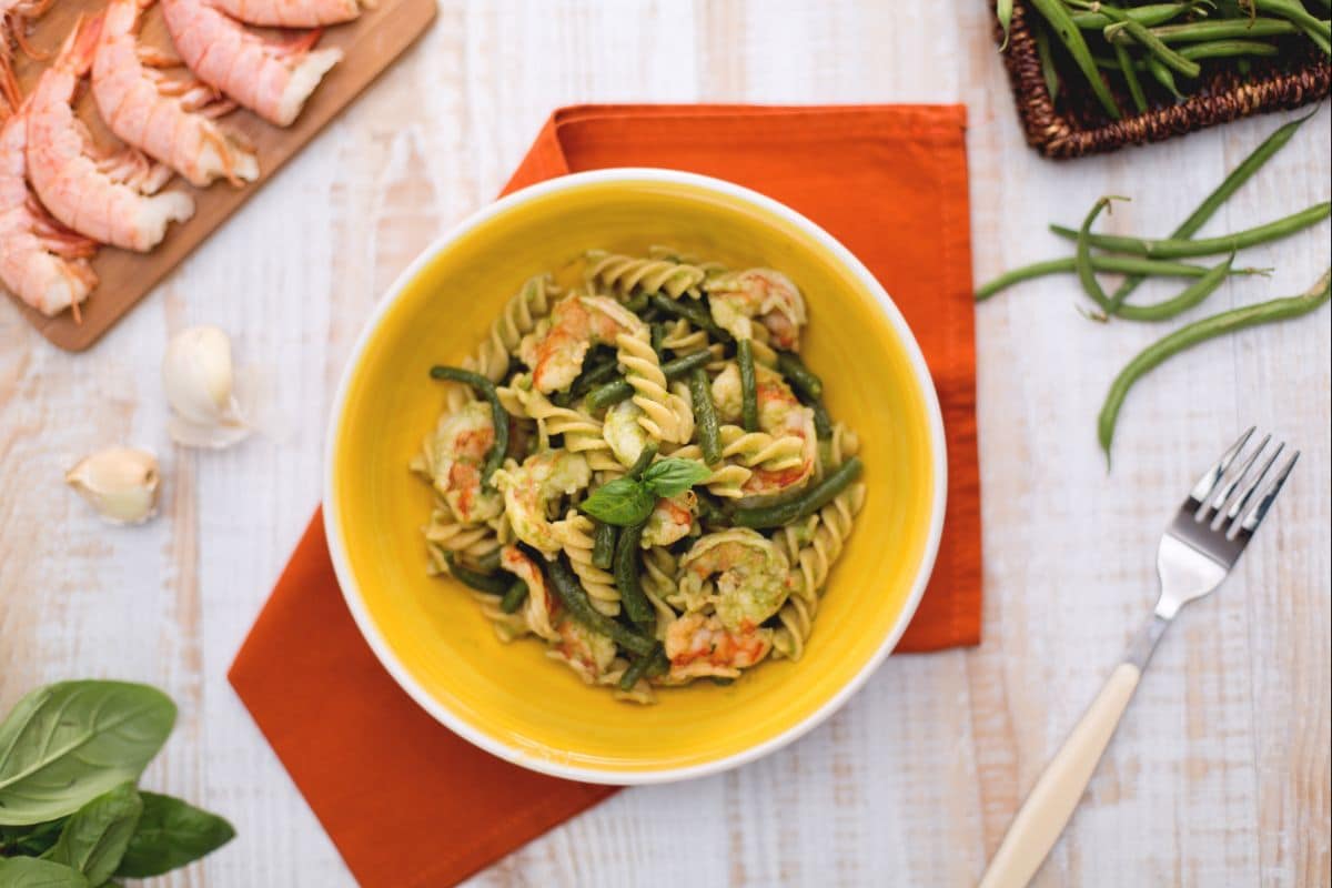 Whole wheat fusilli with green beans, shrimp tails, and basil sauce