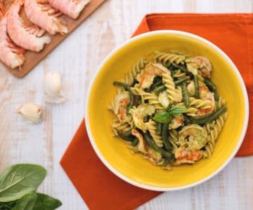 Whole wheat fusilli with green beans, shrimp tails, and basil sauce