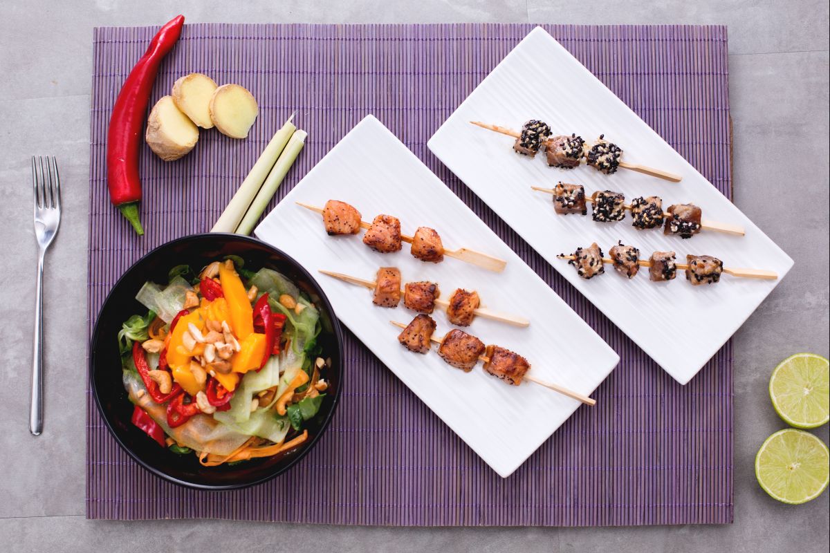 Tuna and salmon skewers with Thai salad