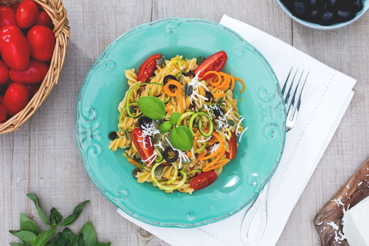 Whole wheat fusilli alla crudaiola with vegetables, pumpkin seeds and salted ricotta