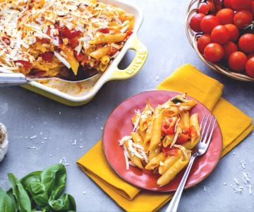 Baked penne with tomato and salted ricotta