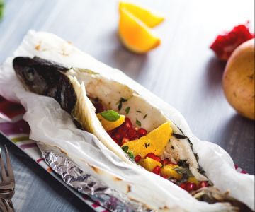 Sea bass en papillote with citrus and pomegranate