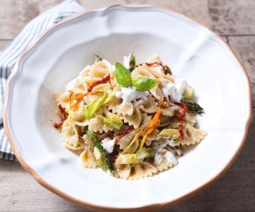 Pasta with asparagus, stracciatella, and zucchini flowers