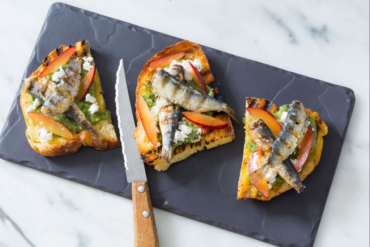 Bruschetta with herb pesto and grilled sardines