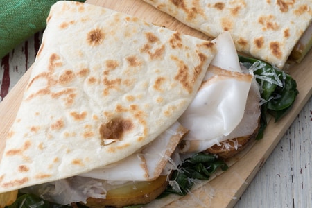 Piadina with greens, potatoes, and Colonnata lard