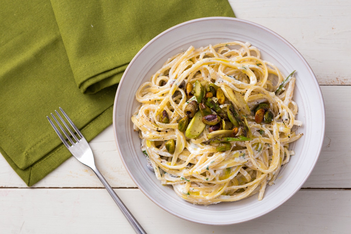 Pasta with ricotta cream, asparagus, and pistachios