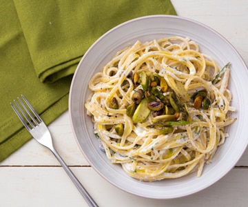 Pasta with ricotta cream, asparagus, and pistachios