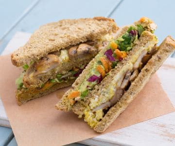 Club sandwich with scrambled eggs