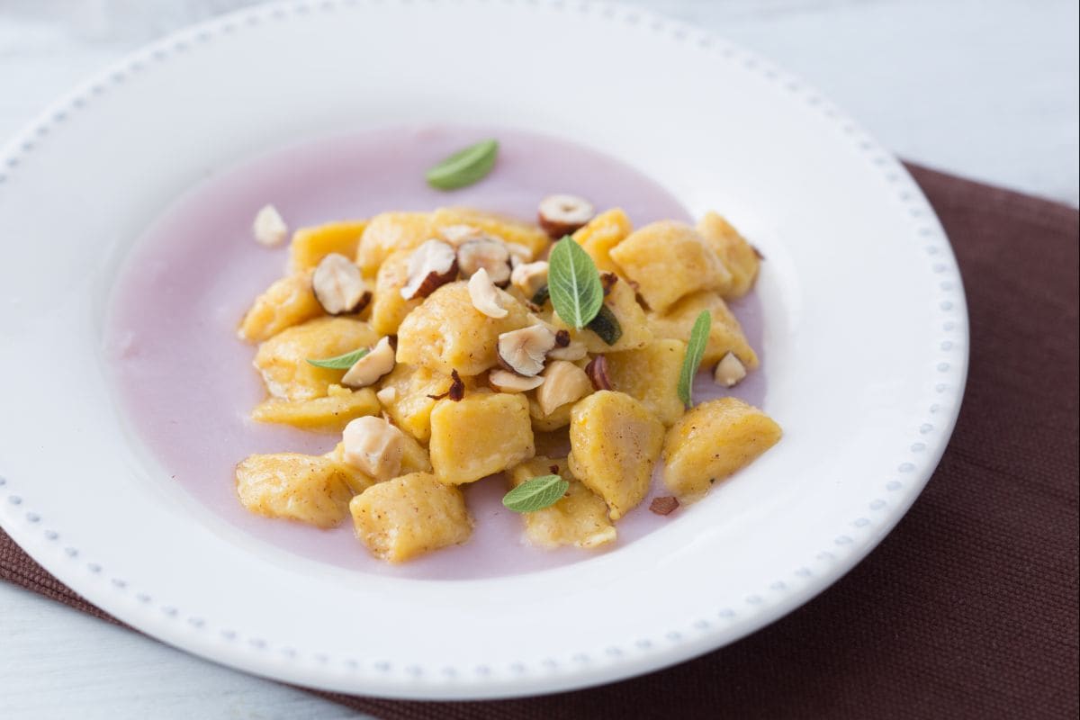 Pumpkin gnocchi on purple potato cream