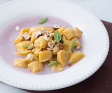 Pumpkin gnocchi on purple potato cream
