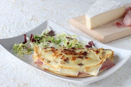 Potato crepes with brie and ham