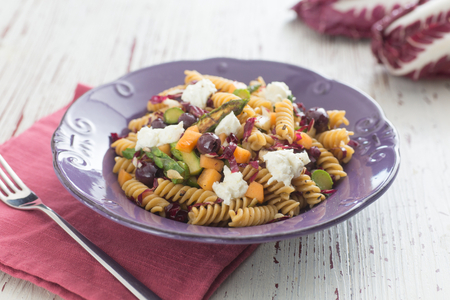 Pasta salad with asparagus, melon and goat cheese