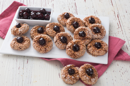 Amaretti with cherries in syrup