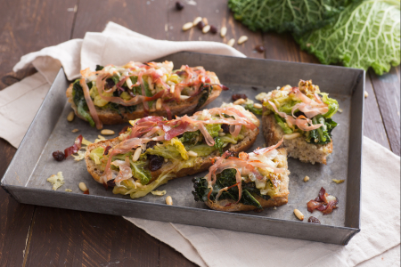 Crostoni with savoy cabbage, casera cheese and speck
