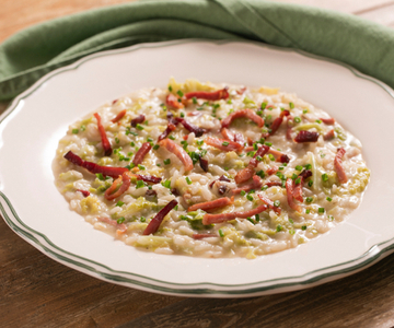 Risotto with Savoy cabbage, speck, and fontina