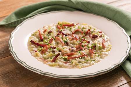 Risotto with Savoy cabbage, speck, and fontina