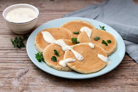 Savory pancakes with Grana Padano PDO sauce