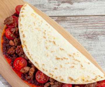 Flatbread with 'nduja, sausage and cherry tomatoes