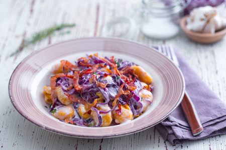 Pumpkin gnocchi with Grana Padano, red cabbage and speck