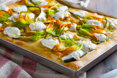 Potato focaccia with burrata and zucchini flowers