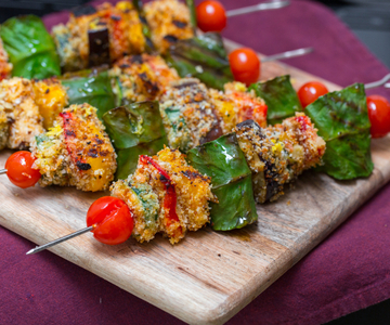 Skewers of scamorza cheese on the bbq