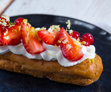 Cream-filled Éclair with whipped cream