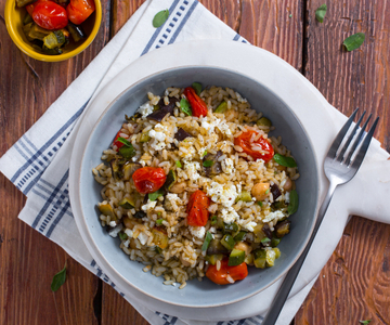 Warm rice with chickpeas, roasted vegetables, and feta