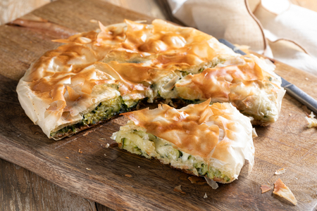 Savory pie with phyllo dough in a pan with zucchini