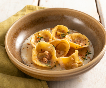Pumpkin and amaretti filled cappellacci on provola fondue