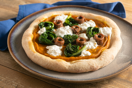 Winter Pizza with Pumpkin Cream, Anchovies, and Burrata